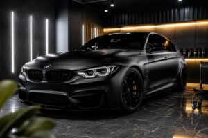 Sleek matte BMW in cinematic garage