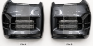 Two identical car front bumpers side by side under consistent studio lighting, each with a different protective film sample applied, subtle "Film A" and "Film B" labels, clean white background, top-down photorealistic flat lay.